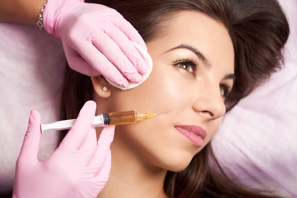 woman receiving dermal filler injection